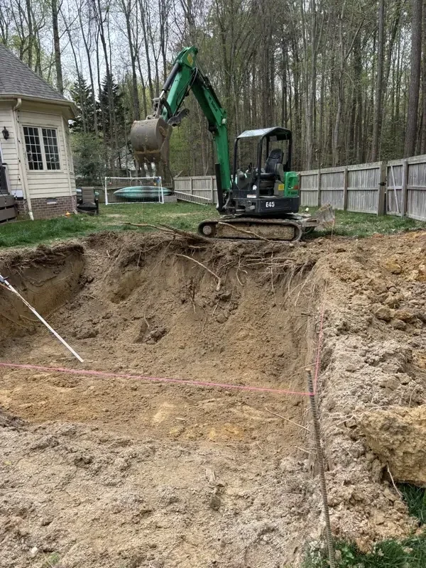 Excavation services Hampton Roads VA - mini excavator digging for pool installation
